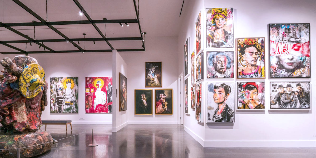 Gallery installation of colourful mixed media artworks by BNS